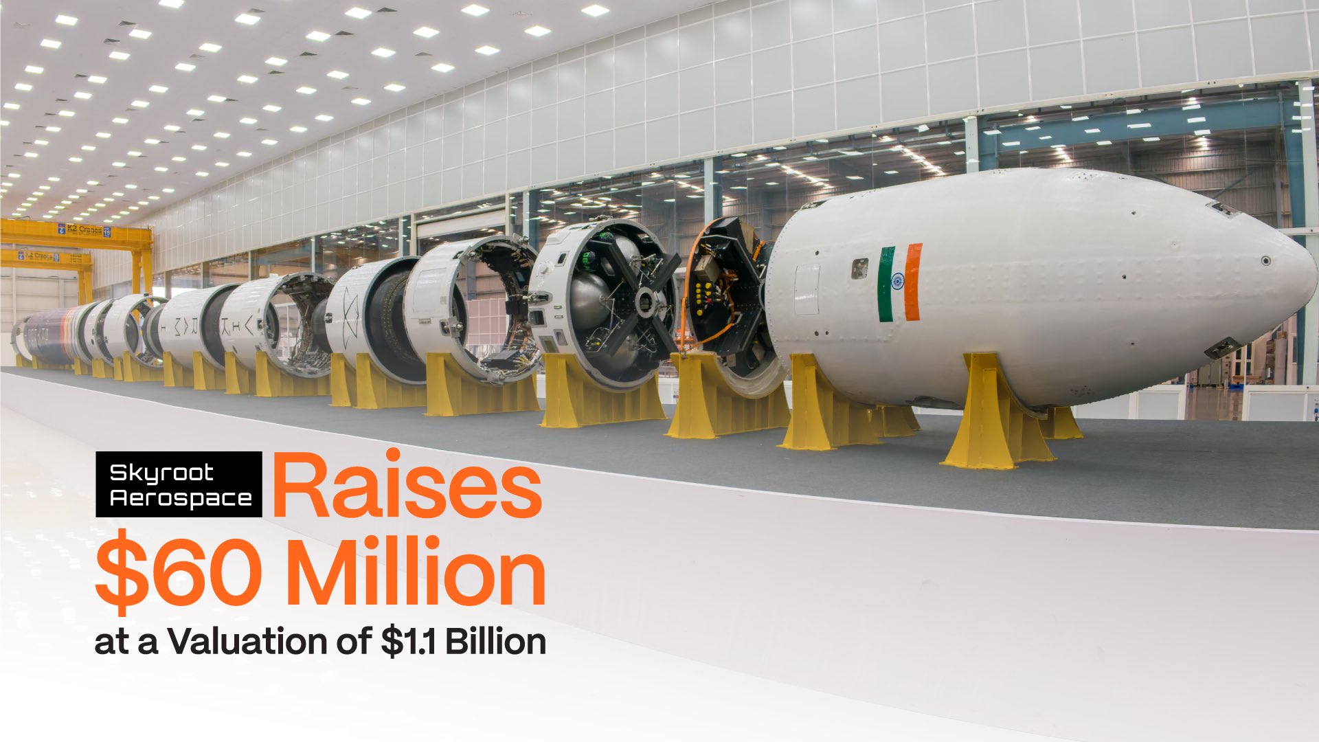 Vikram-1 rocket on display in the Skyroot Aerospace assembly hall, with the announcement card 'Skyroot Aerospace Raises $60 Million at a Valuation of $1.1 Billion'.