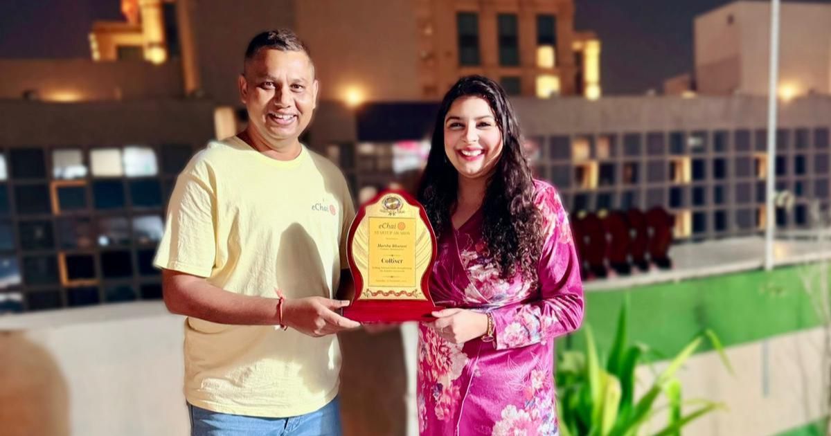 Jatin Chaudhary handing the eChai Startup Award to Harsha Bhurani (CEO, Hummingbird) on the IIMA Ventures terrace